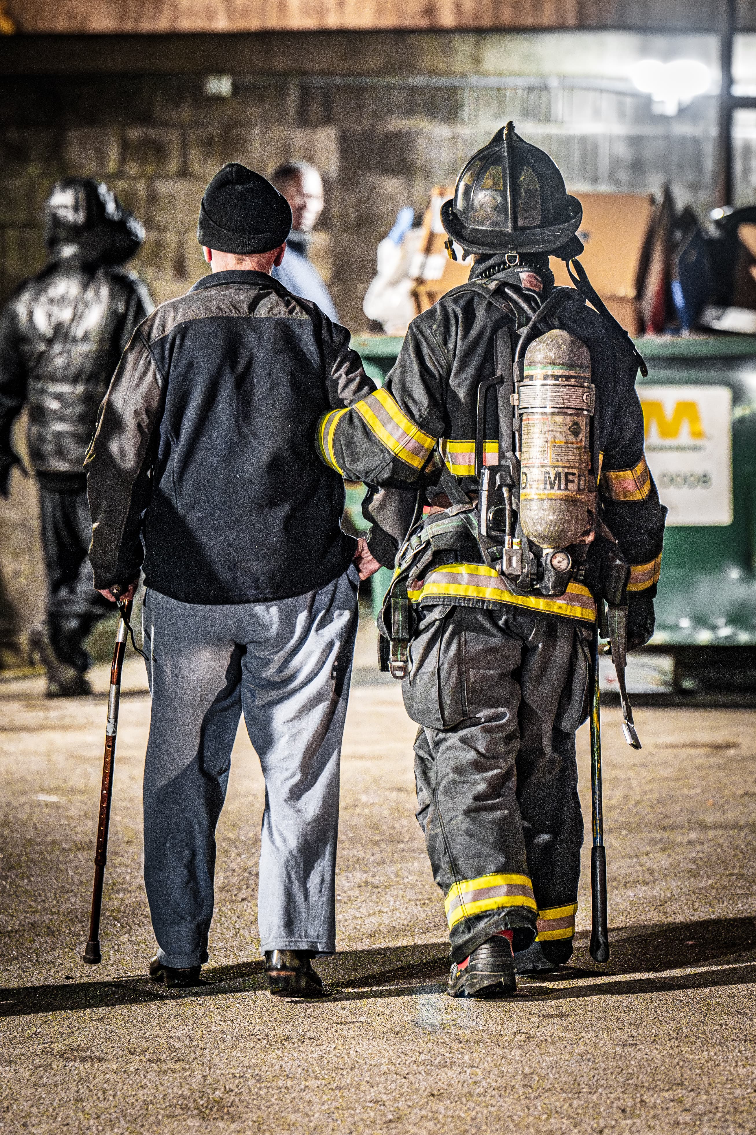 Milwaukee firefighter assisting a community member